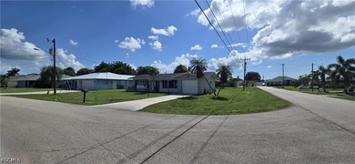 Thoughtfully positioned on a corner lot in SE Cape Coral, this - photo 7