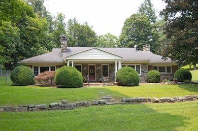 Welcome to this beautifully renovated one-level home, situated - photo 1