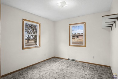 Welcome to this charming ranch-style residence that perfectly