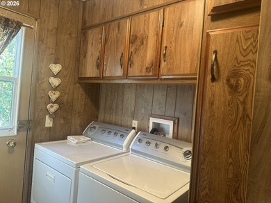 This well-maintained manufactured home is tucked in the hills - photo 13