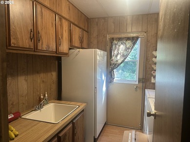 This well-maintained manufactured home is tucked in the hills - photo 14