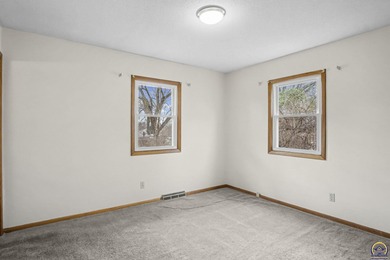 Welcome to this charming ranch-style residence that perfectly