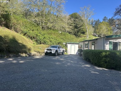 This well-maintained manufactured home is tucked in the hills - photo 15
