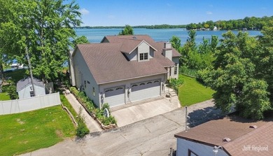 This immaculate, custom-built Gun Lake home is being offered for - photo 1