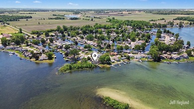 This immaculate, custom-built Gun Lake home is being offered for - photo 3