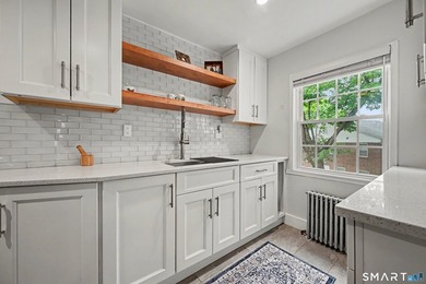 Completely renovated and move-in ready, this stylish two-level - photo 11