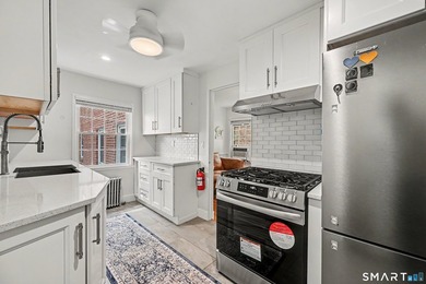 Completely renovated and move-in ready, this stylish two-level - photo 13