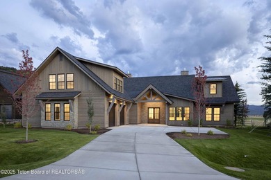 This custom home in Teton Reserve offers a unique plan with - photo 1