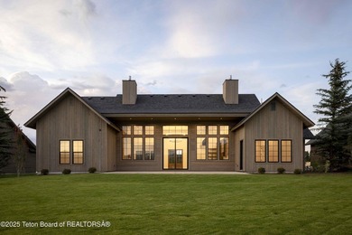 This custom home in Teton Reserve offers a unique plan with - photo 3