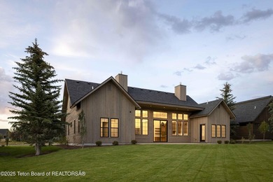 This custom home in Teton Reserve offers a unique plan with - photo 4