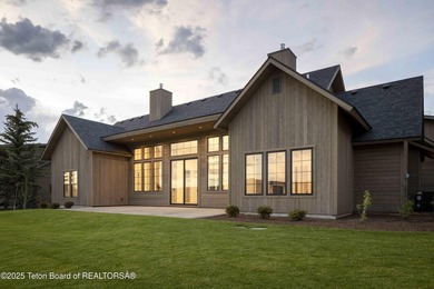 This custom home in Teton Reserve offers a unique plan with - photo 5