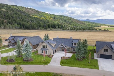 This custom home in Teton Reserve offers a unique plan with - photo 7