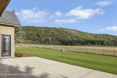 This custom home in Teton Reserve offers a unique plan with - photo 8