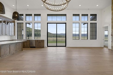 This custom home in Teton Reserve offers a unique plan with - photo 10