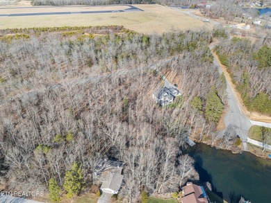 Beautiful wooded lakefront lot on Holiday Hills Lake, located in - photo 5
