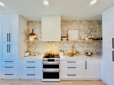 Welcome to an exceptional upgraded estate in the gated - photo 3