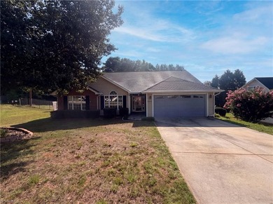 5702 River Glen Dr is a one-story Greensboro home with a - photo 1