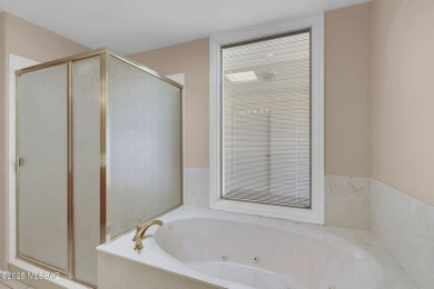 Welcome to this beautifully maintained 3-bedroom end unit in the