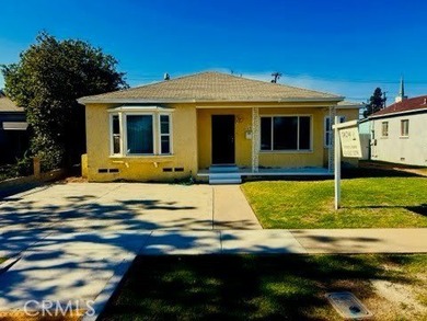 Welcome to this charming 4-bedroom, 2-bathroom Long Beach home - photo 1