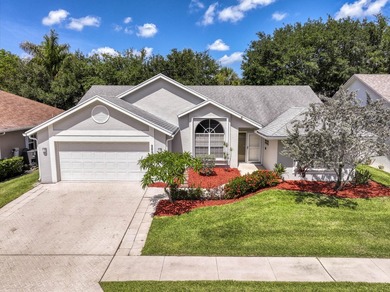 Manicured landscaping and soaring vaulted ceilings welcome you - photo 1