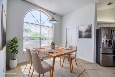 Manicured landscaping and soaring vaulted ceilings welcome you - photo 3