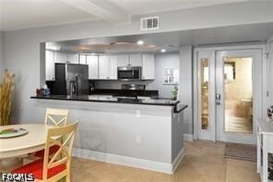 Enjoy beachfront living in this beautifully remodeled 2-bedroom - photo 10