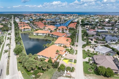 MOVE-IN READY, 1ST FLOOR TARPON COVE CONDO W/2-CAR GARAGE & POND - photo 2