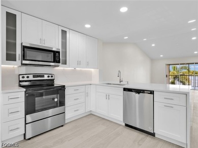 Welcome to this FULLY RENOVATED condo offering tranquil lake - photo 1