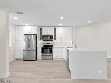 Welcome to this FULLY RENOVATED condo offering tranquil lake - photo 8