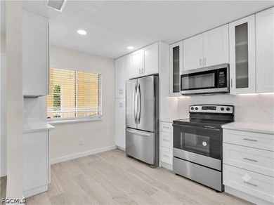 Welcome to this FULLY RENOVATED condo offering tranquil lake - photo 9