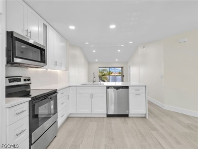 Welcome to this FULLY RENOVATED condo offering tranquil lake - photo 10