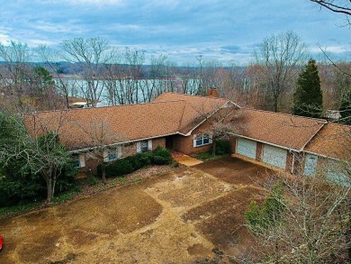WATERFRONT! MAGNIFICENT One owner 7-BR 5-Bath home situated on 3 - Lake Home For Sale in Camden, Tennessee