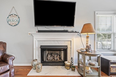 This spacious five-bedroom, four-bathroom raised beach home is