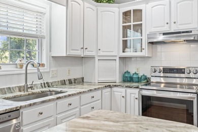 This spacious five-bedroom, four-bathroom raised beach home is