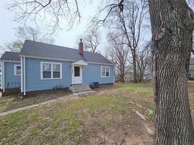 Bungalow style home on .5 acres in Saydel school system in NE