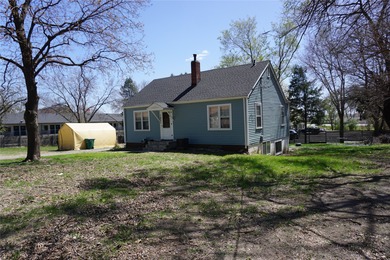 Bungalow style home on .5 acres in Saydel school system in NE