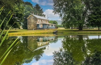 Built in 1838, this extraordinary 3,000-square-foot stone home - photo 2