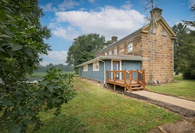 Built in 1838, this extraordinary 3,000-square-foot stone home - photo 4