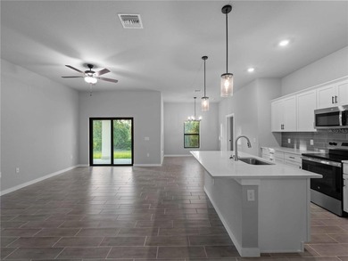 Tile throughout. Quartz countertops. Impact windows. Paver - photo 14