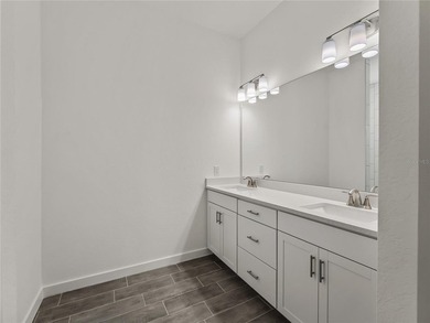 Tile throughout. Quartz countertops. Impact windows. Paver - photo 14