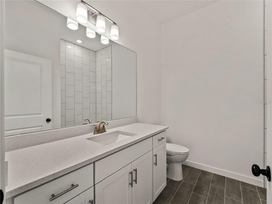 Tile throughout. Quartz countertops. Impact windows. Paver - photo 22