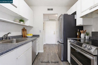 Stylishly updated end-unit condo with a large private deck &