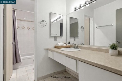 Stylishly updated end-unit condo with a large private deck &