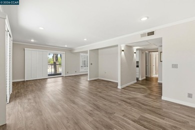 Stylishly updated end-unit condo with a large private deck &