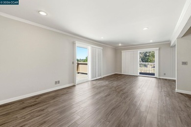 Stylishly updated end-unit condo with a large private deck &