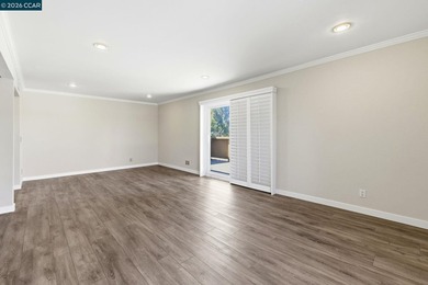 Stylishly updated end-unit condo with a large private deck &