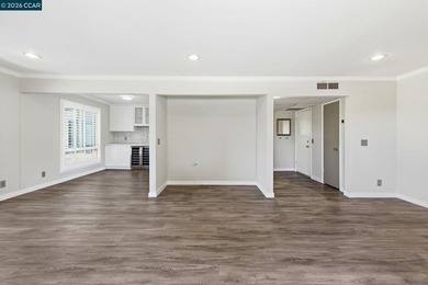 Stylishly updated end-unit condo with a large private deck &