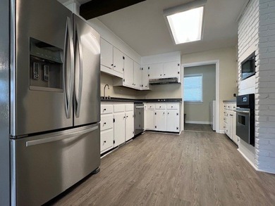 Big open water front home on Lake Sinclair! Located on the - photo 11