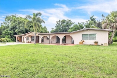 Situated on a spacious 0.65-acre corner lot surrounded by mature - photo 1