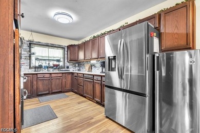 Situated on a spacious 0.65-acre corner lot surrounded by mature - photo 8